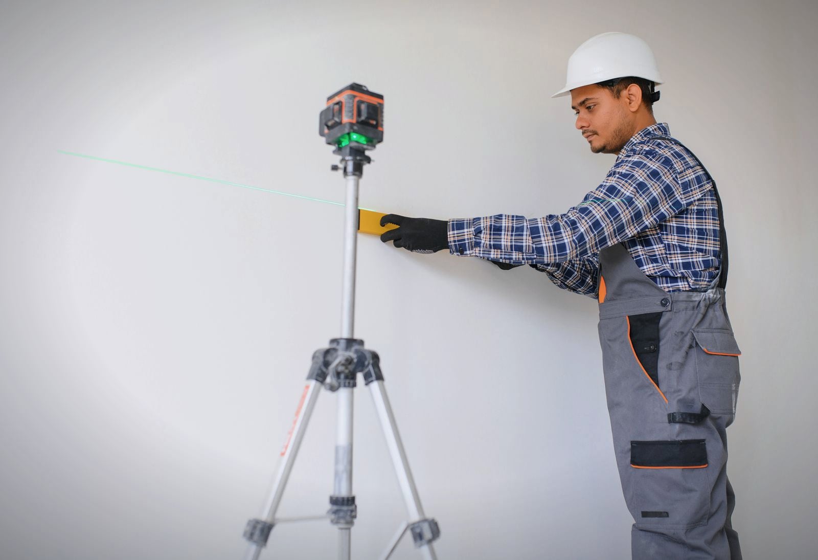 A tradesperson finishing work in a newly fitted-out apartment