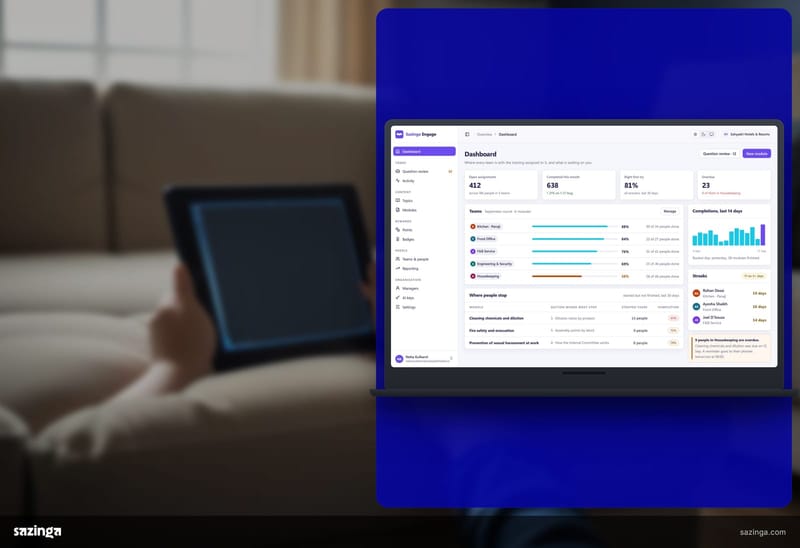 A child's hands holding a tablet showing the Sazinga Engage dashboard, seen from a sofa at home.