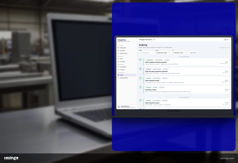 A laptop on a workshop bench showing the audit log in Sazinga Comply.