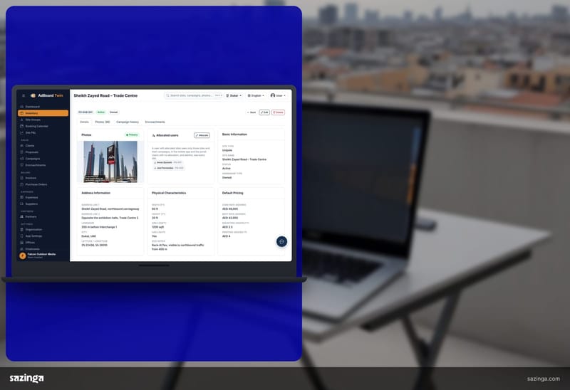 An operations manager on a rooftop terrace checking a board location record in Sazinga AdBoard on a laptop.