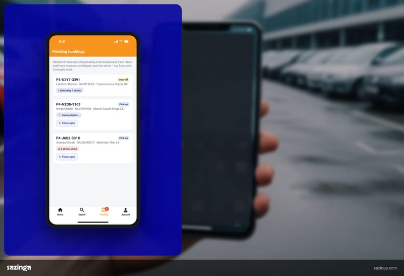 A driver in a car park checking the bookings list in Sazinga Rentals on a phone.